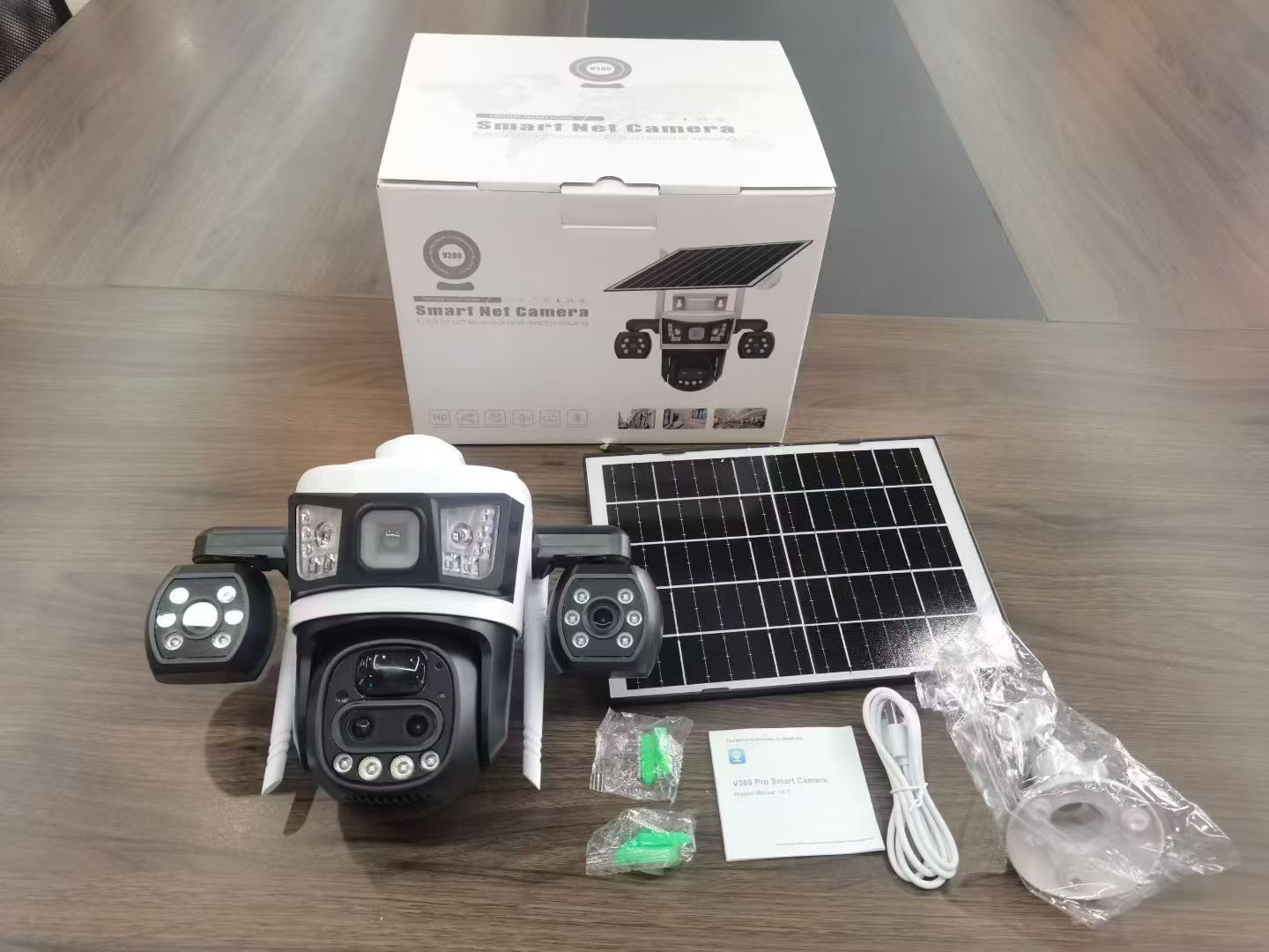 Outdoor camera kit with a solar panel, packaging and accessories
