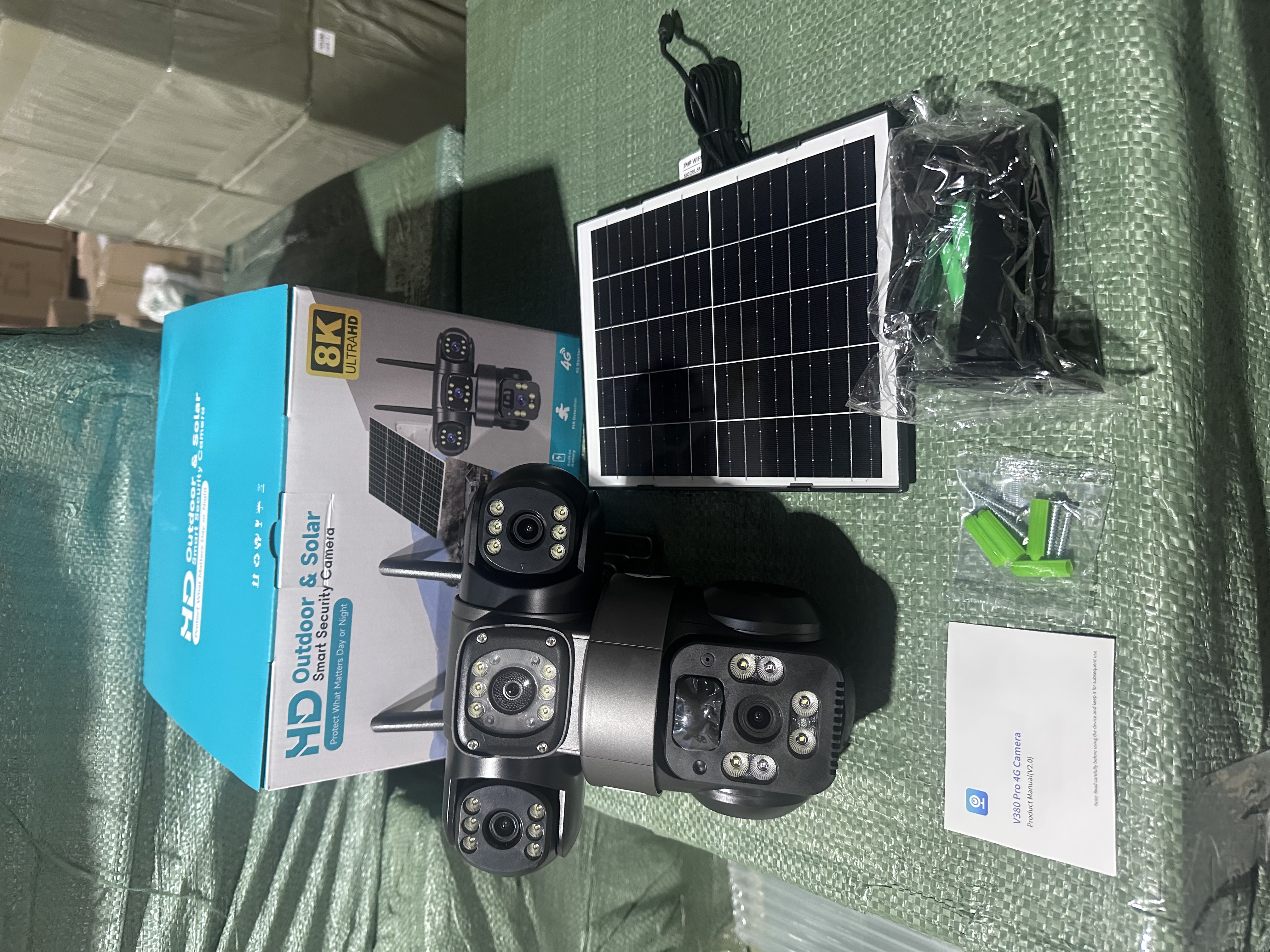Outdoor camera kit with separate solar panel, packaging, manual and accessories