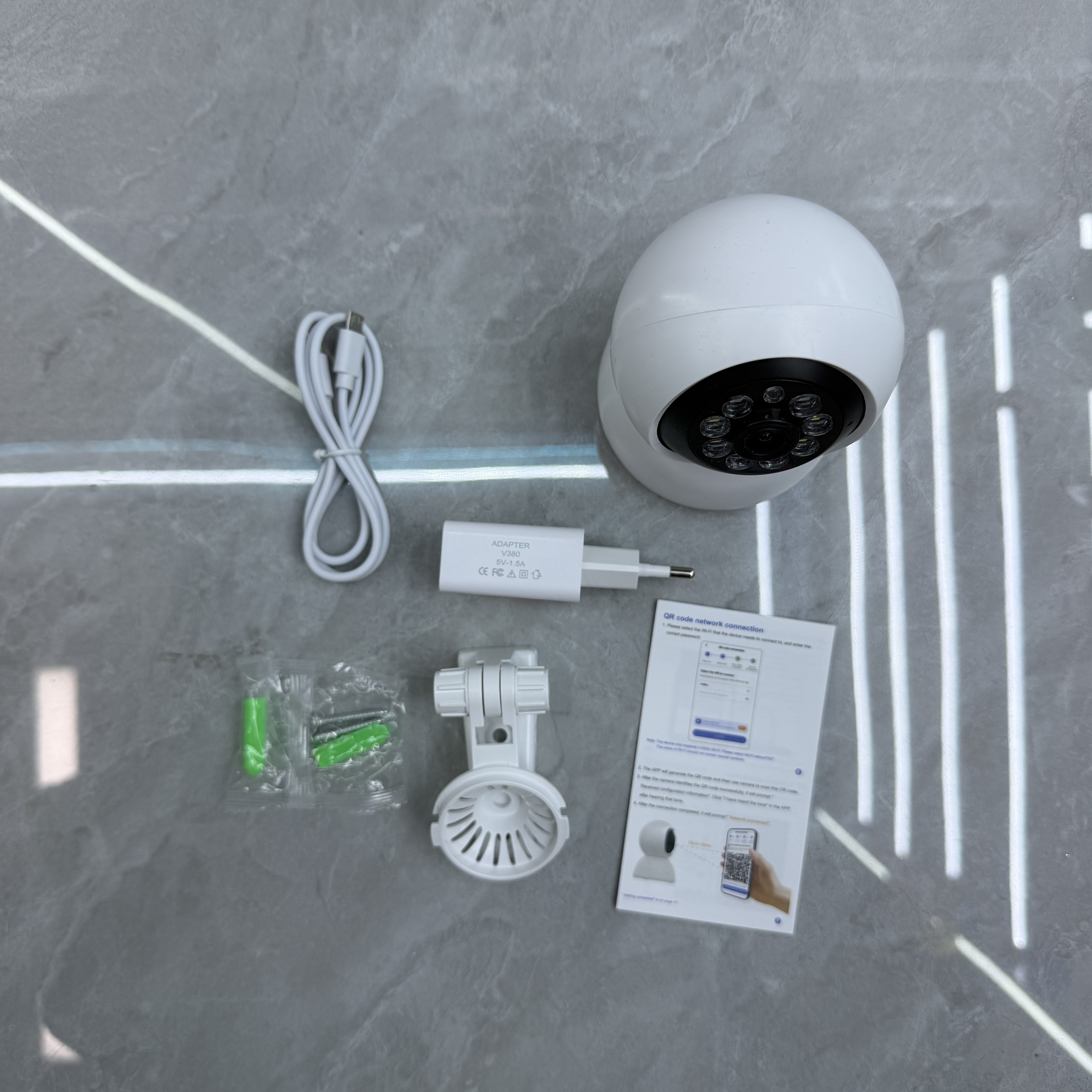 Compact white camera and USB accessories