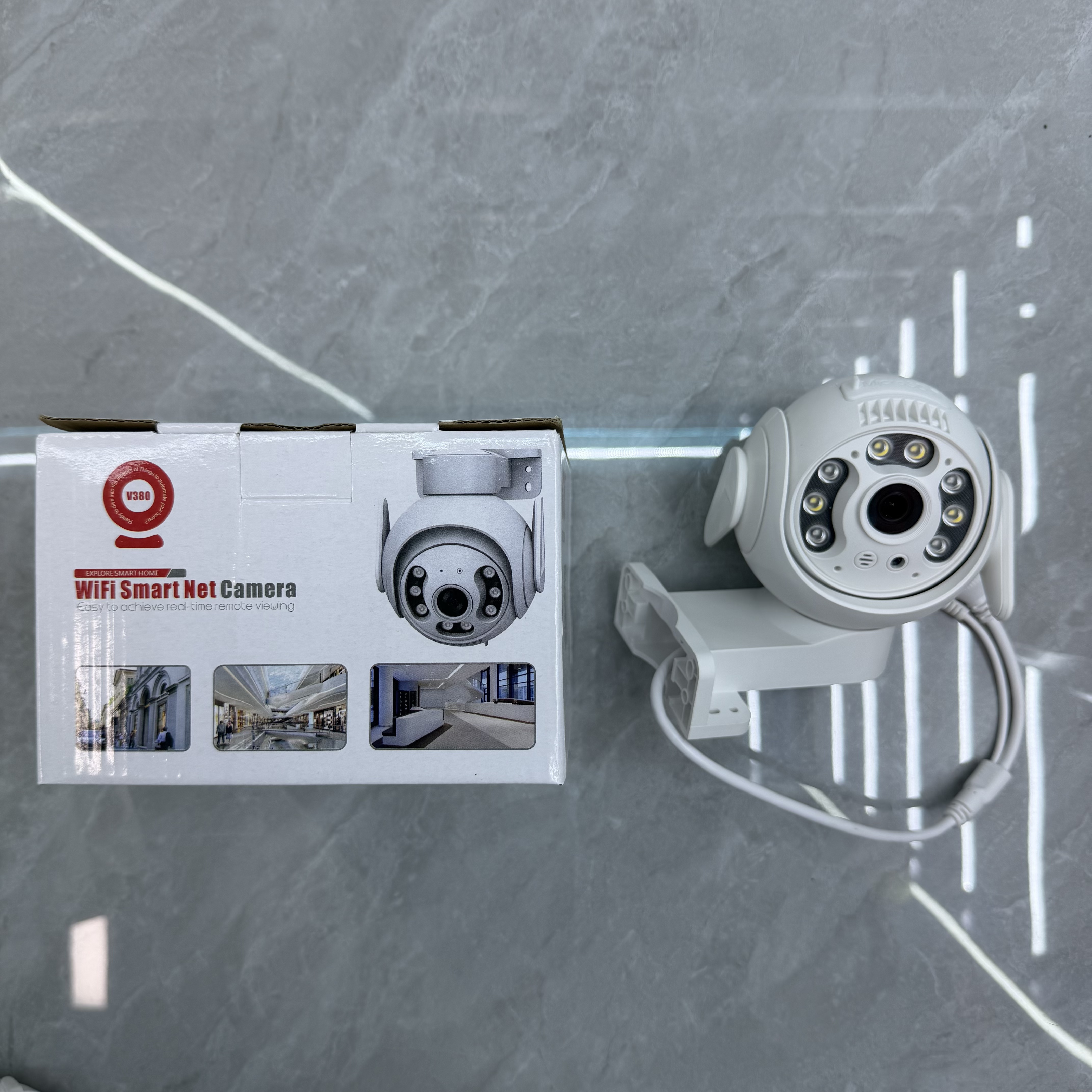 White camera and WiFi-labelled box