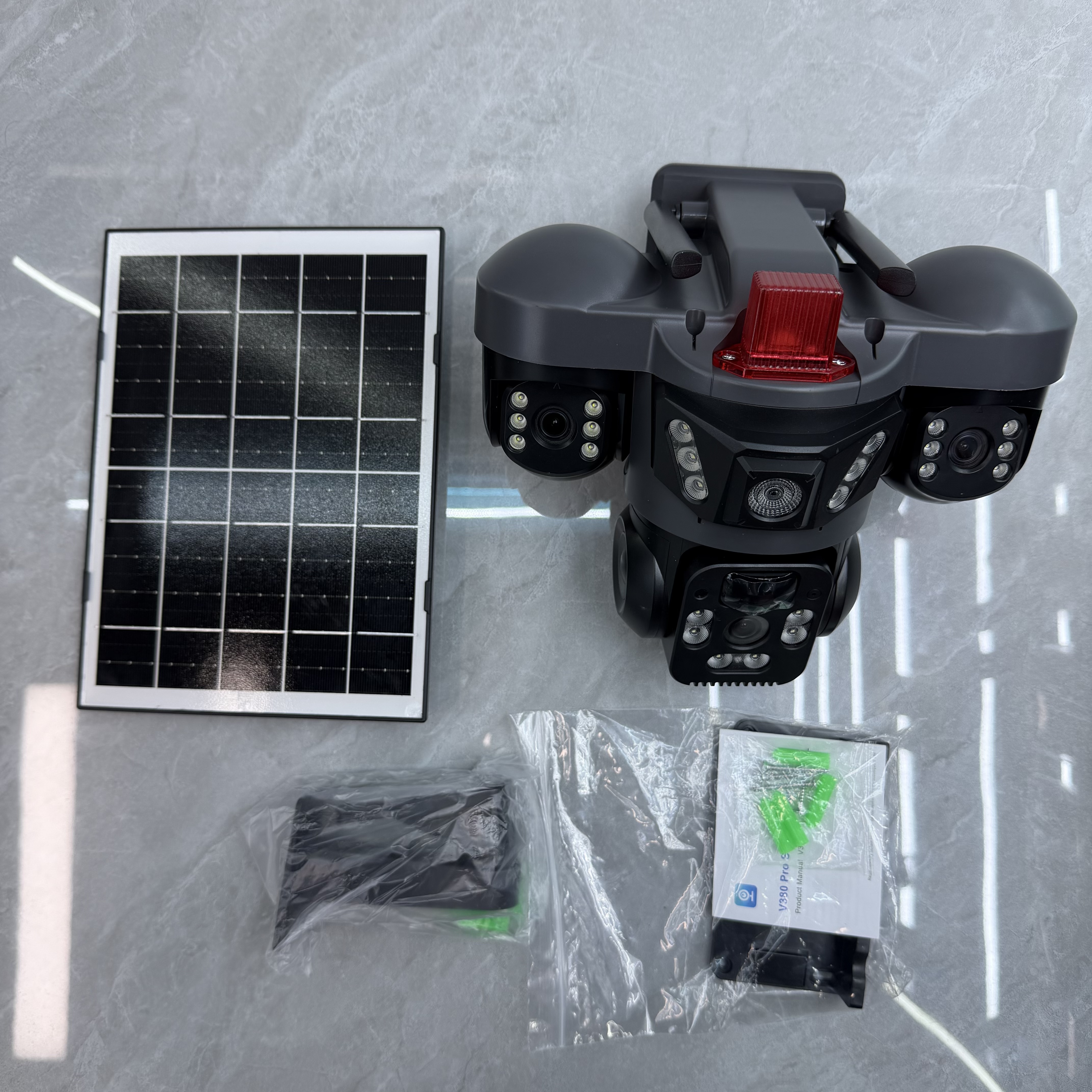 Solar multi-module camera with alarm housing