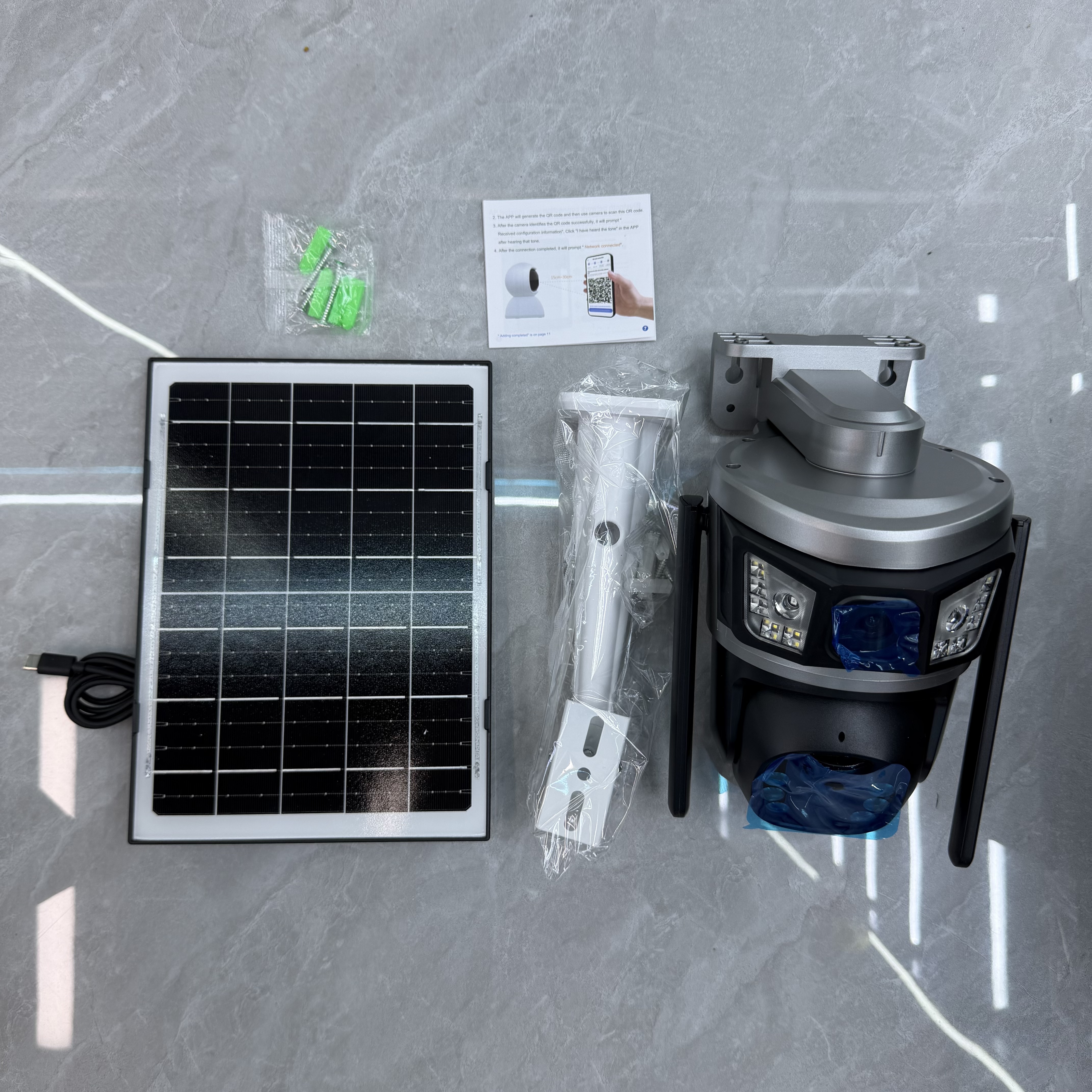Silver solar camera with mounting parts